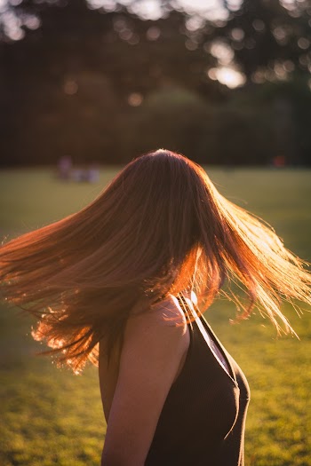 Photo of Woman Swinging Her Hair 
