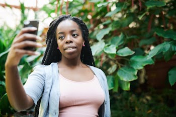 Photo Of Woman Taking Photo 