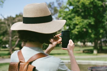 Photo Of Woman Taking Photo Of Tree 