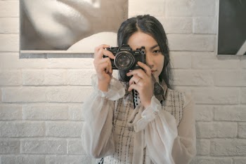 Photo of Woman Taking Photo Using Camera