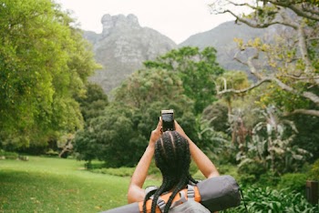 Photo Of Woman Taking Picture Of Nature