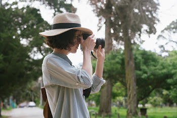 Photo Of Woman Taking Pictures
