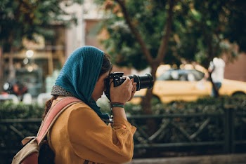 Photo Of Woman Taking Pictures