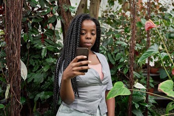 Photo of Woman Taking Selfie Near Plants