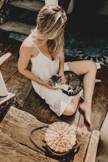 Photo Of Woman Touching Cat