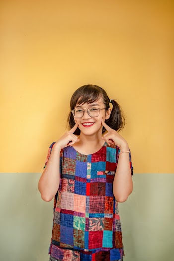 Photo of Woman Touching Her Cheeks