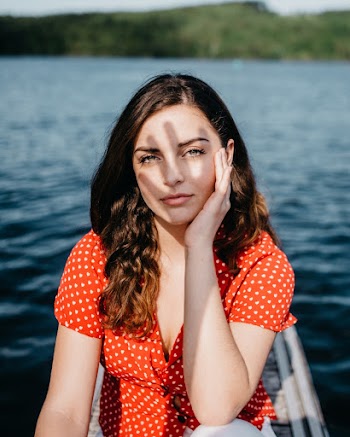 Photo of Woman Touching Her Face