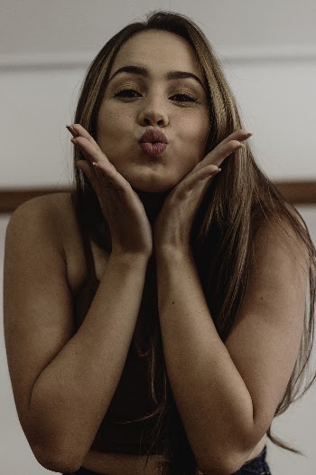 Photo Of Woman Touching Her Face