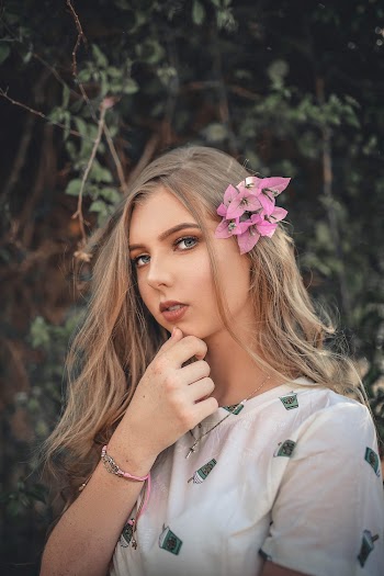 Photo Of Woman Touching Her Face