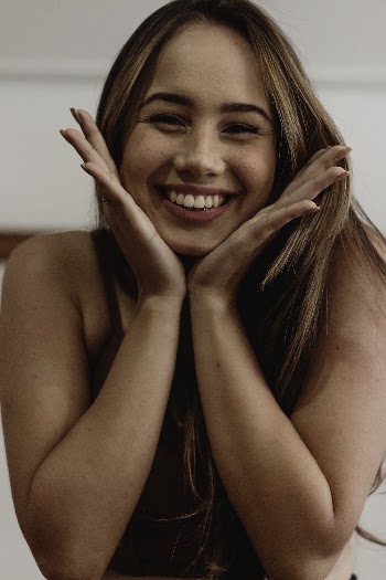 Photo Of Woman Touching Her Face
