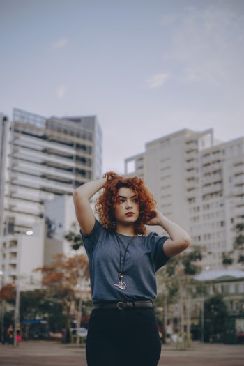 Photo of Woman Touching Her Hair