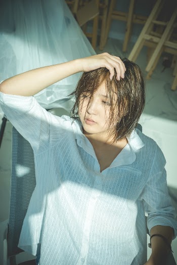 Photo Of Woman Touching Her Hair