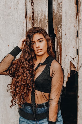 Photo Of Woman Touching Her Hair
