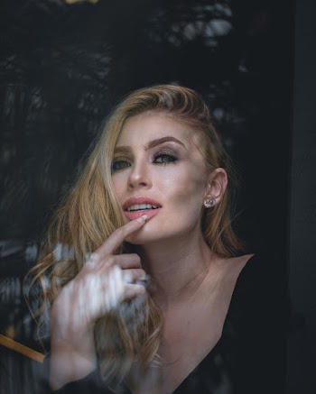 Photo of Woman Touching Her Lips