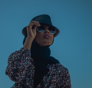 Photo Of Woman Touching Her Sunglasses