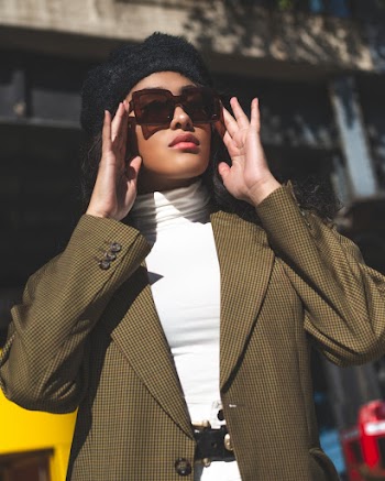 Photo Of Woman Touching Her Sunglasses