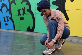 Photo of Woman Tying Her Shoes