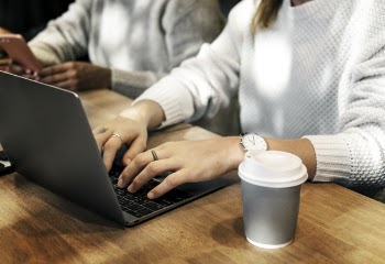 Photo of Woman Typing On Laptop