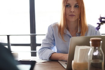 Photo of Woman Using a Laptop