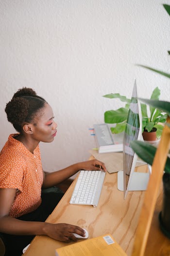 Photo Of Woman Using Computer