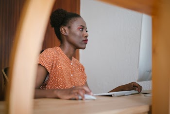 Photo of Woman Using Computer