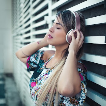 Photo Of Woman Using Headphones