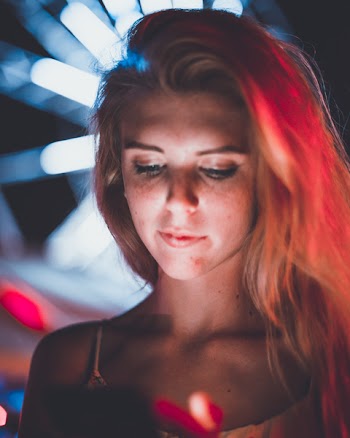 Photo of Woman Using Her Phone
