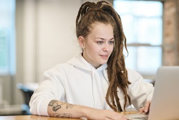 Photo Of Woman Using Laptop