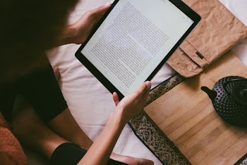 Photo Of Woman Using Tablet