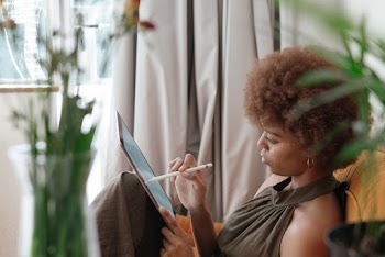 Photo Of Woman Using Tablet