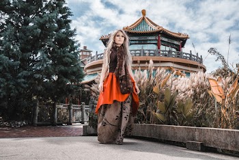 Photo Of Woman Walking Near Plants