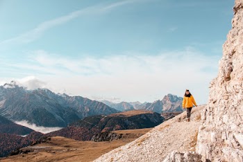 Photo Of Woman Walking Near Rock Formation