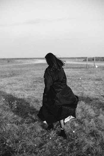 Photo Of Woman Walking On Grass Field