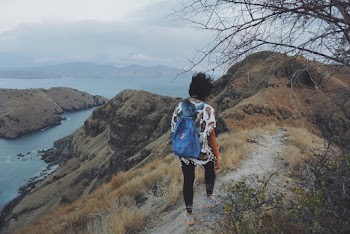 Photo Of Woman Walking On Pathway 