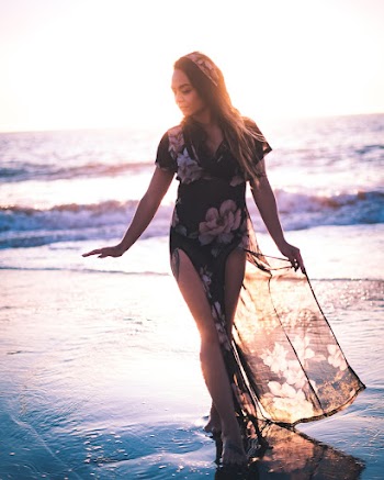 Photo Of Woman Walking On Seashore