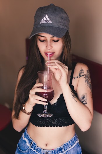Photo of Woman Wearing Adidas Cap