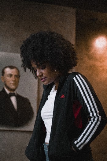 Photo of Woman Wearing Adidas Jacket