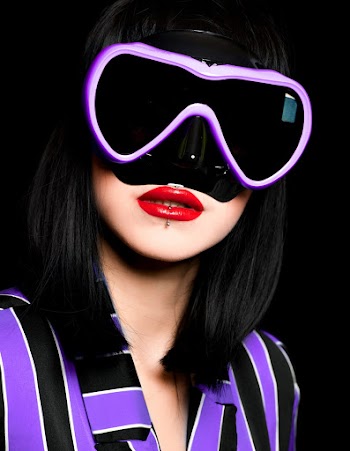 Photo of Woman Wearing Black and Purple Goggles
