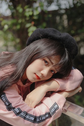 Photo of Woman Wearing Black Beret