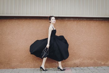 Photo Of Woman Wearing Black Dress