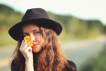 Photo of Woman Wearing Black Hat