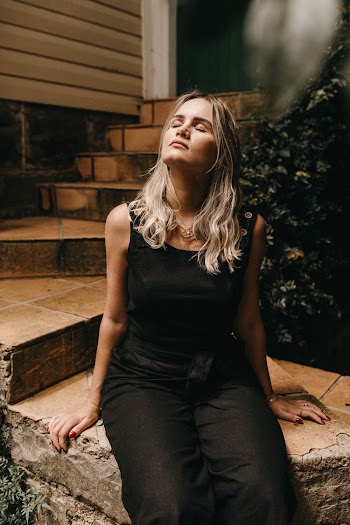 Photo Of Woman Wearing Black Jumpsuit
