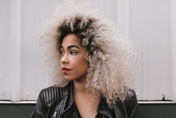 Photo of Woman Wearing Black Leather Jacket