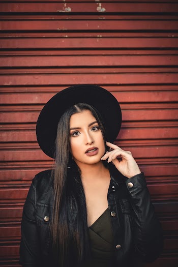Photo of Woman Wearing Black Leather Jacket