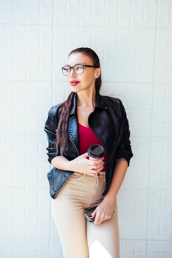 Photo of Woman Wearing Black Leather Jacket