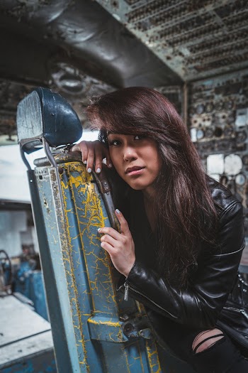 Photo of Woman Wearing Black Leather Jacket