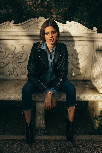 Photo of Woman Wearing Black Leather Jacket