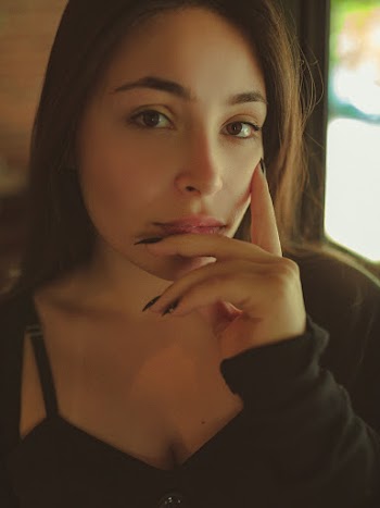 Photo of Woman Wearing Black Long-sleeved Shirt