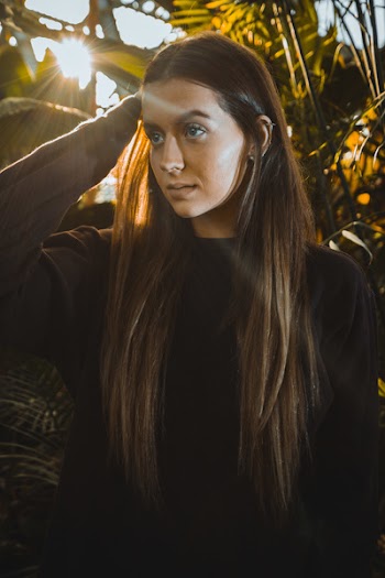 Photo of Woman Wearing Black Long-sleeved Shirt