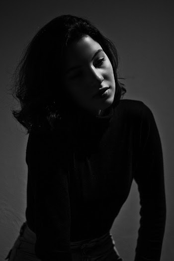 Photo of Woman Wearing Black Long-Sleeved Shirt